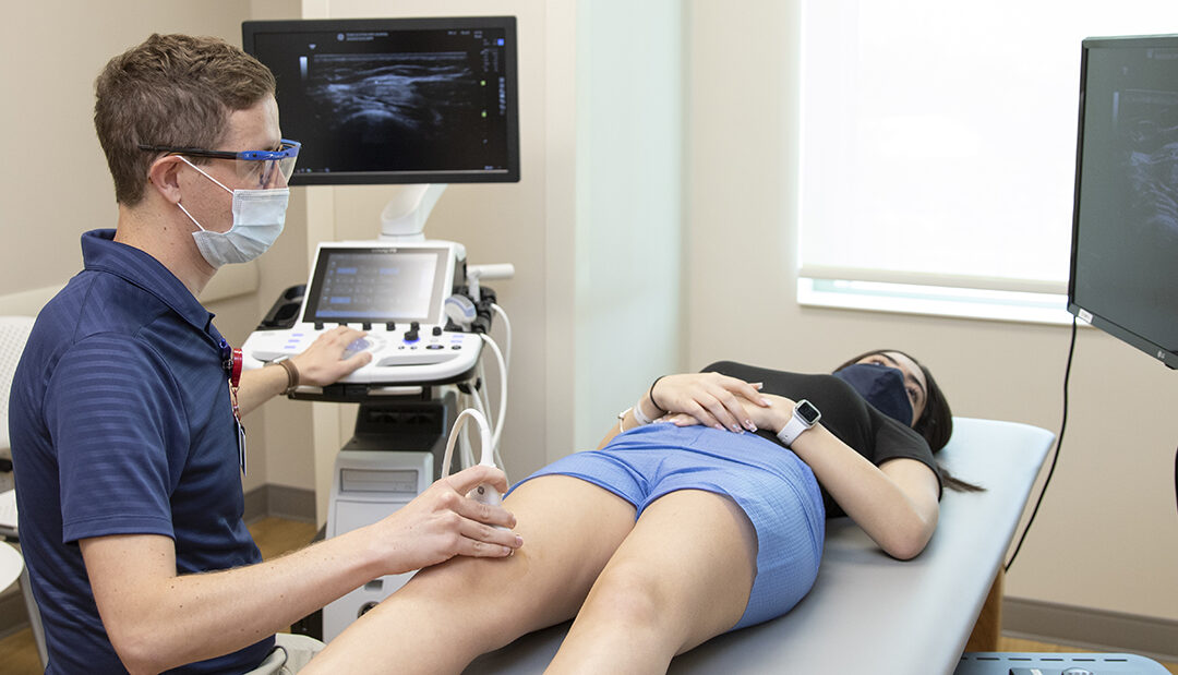 Dr. Jones doing an ultrasound on a patient in clinic