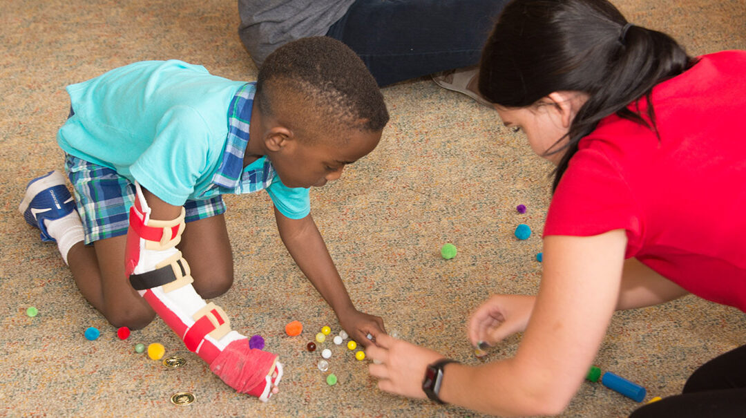 A child participating in the CIMT program.