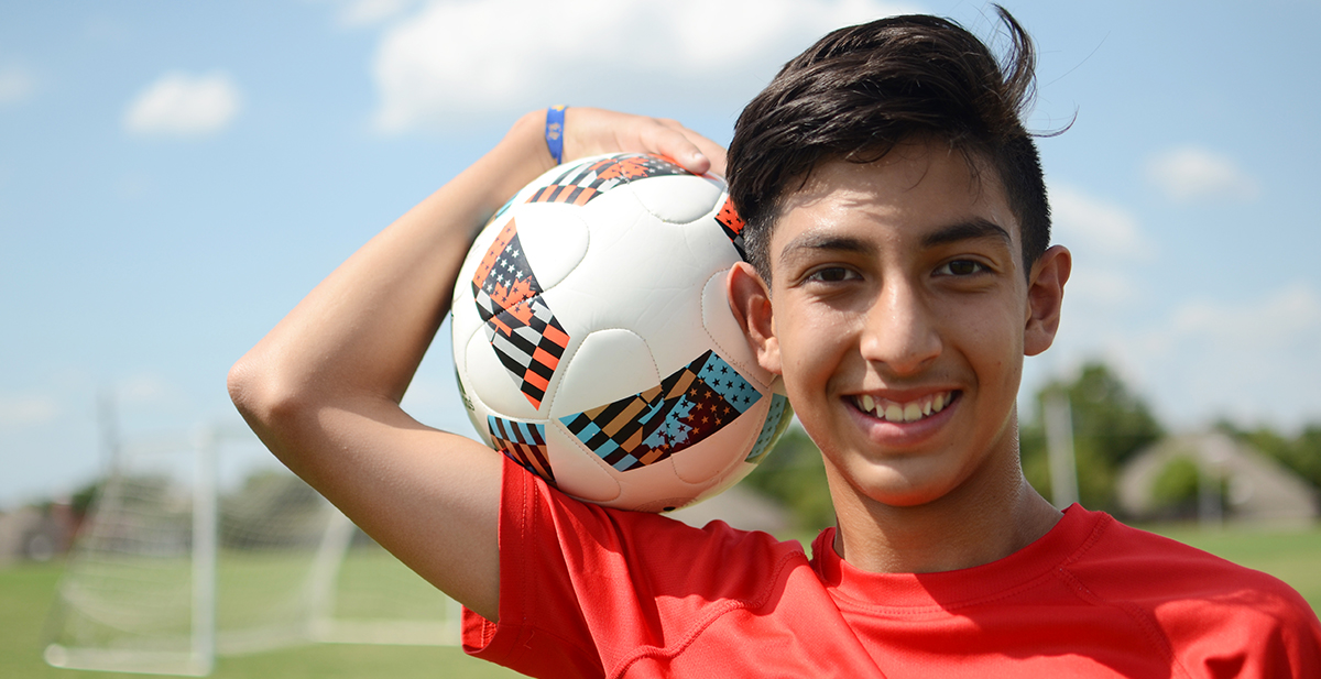 Our patient Jesus with a soccer ball.