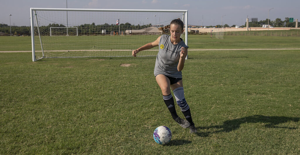 Girl Playing Soccer