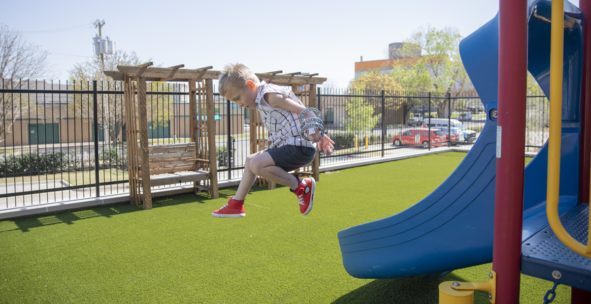 Michael, age 6, playing on playground