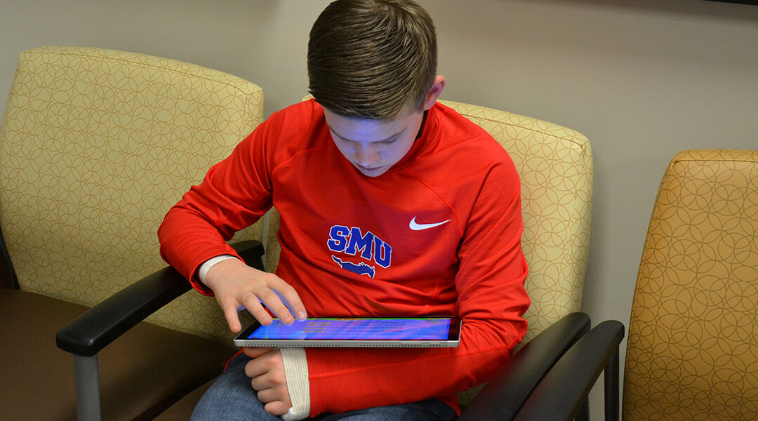 Patient answering a questionnaire before going to his appointment.