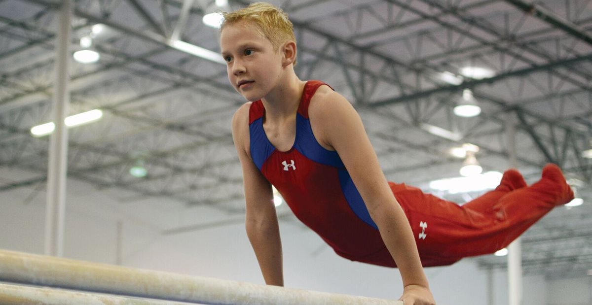 Cody on gymnastic bars