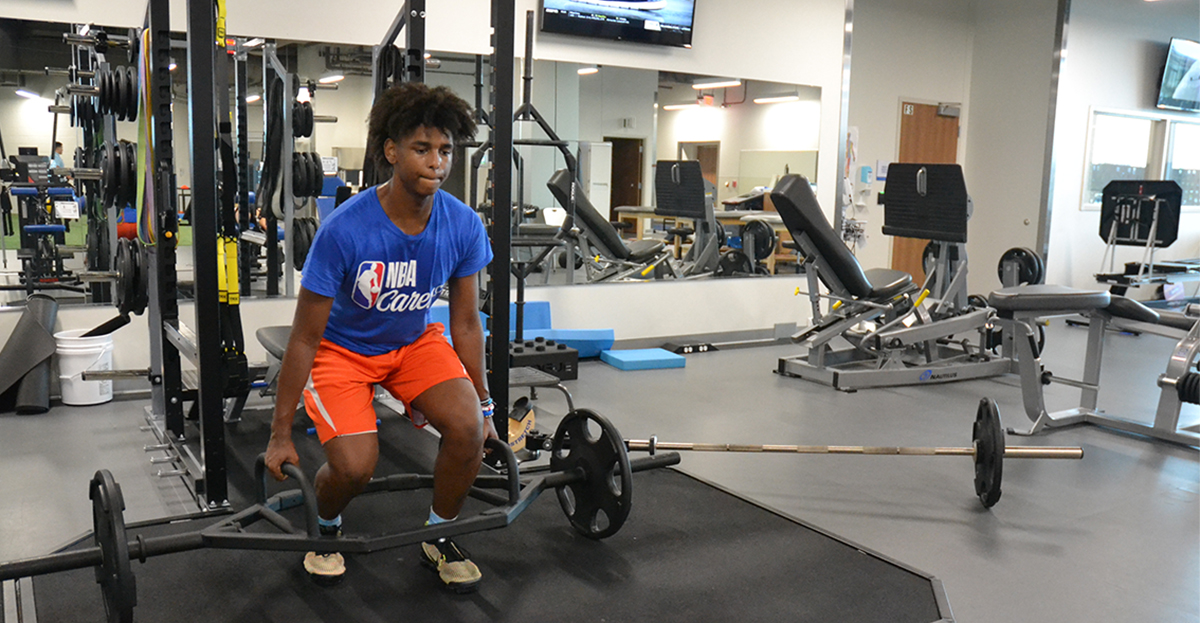 athletes lifting weights