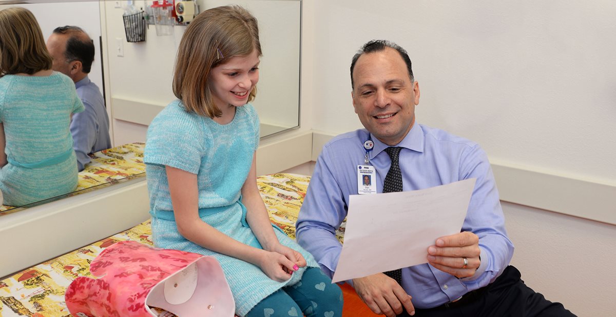 Doctor treating patient with scoliosis at Texas Scottish Rite Hospital for Children