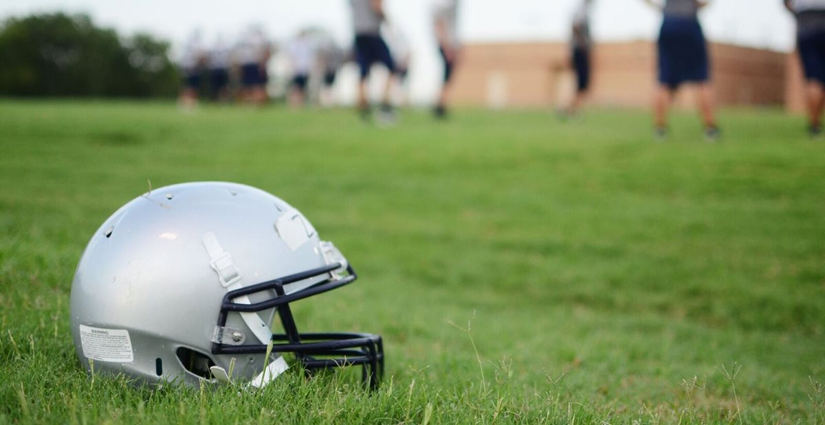 Football helmet in the grass