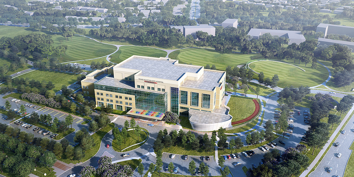 An aerial view of a large building with a rainbow entrance