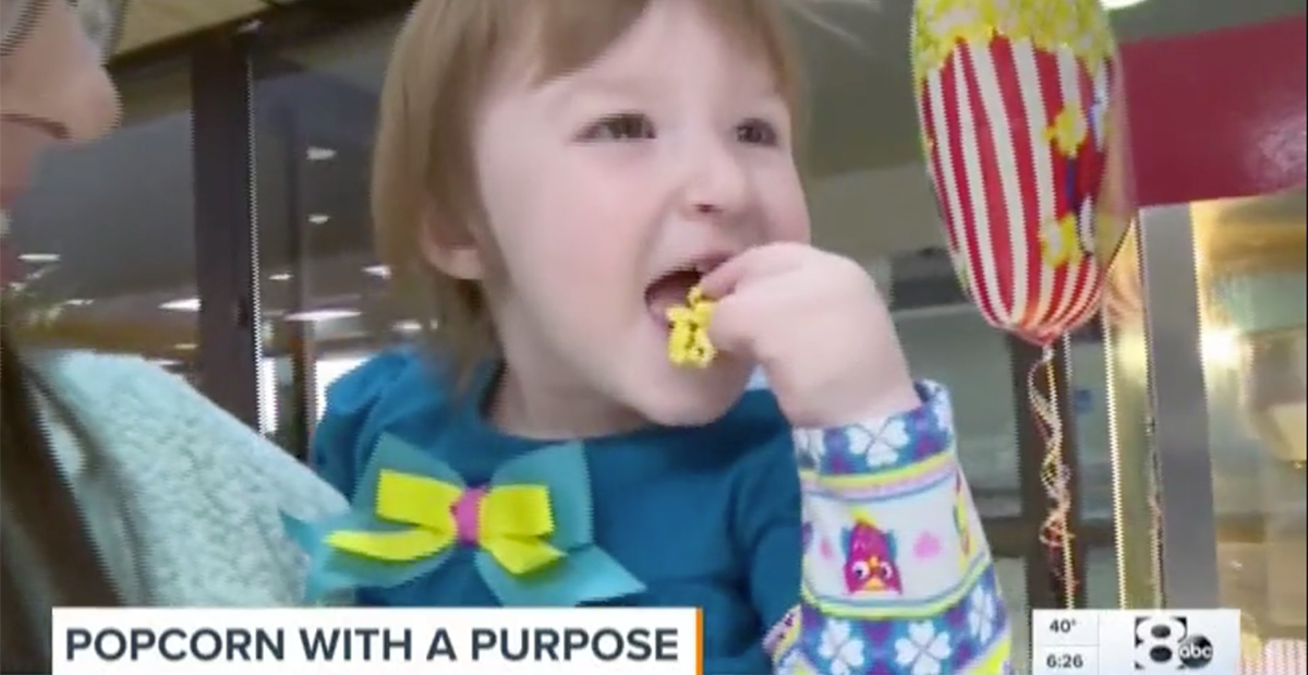 little girl eating popcorn on wfaa