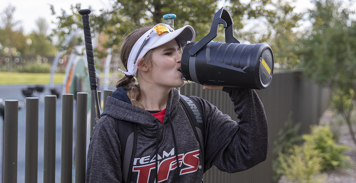 softball player drinking water